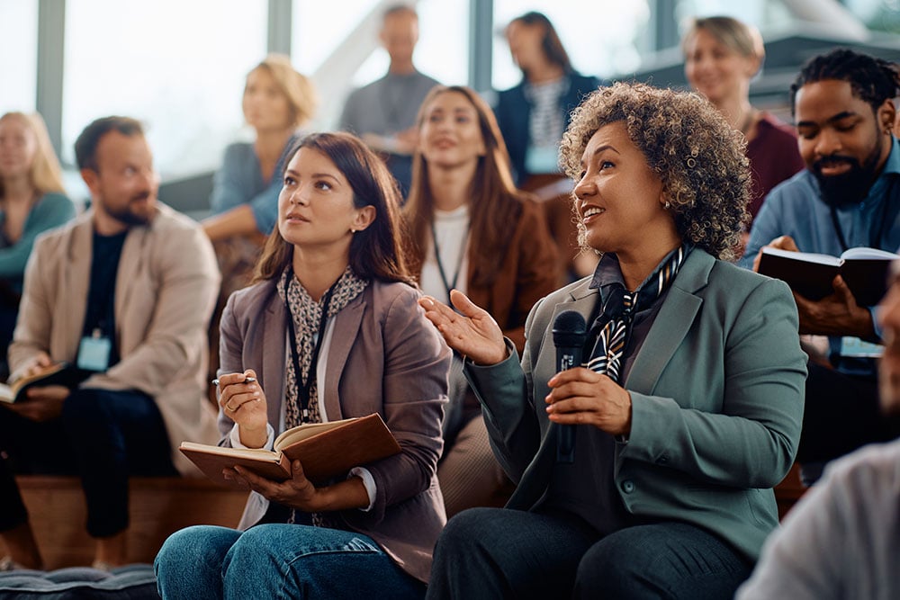 Event attendees asking questions